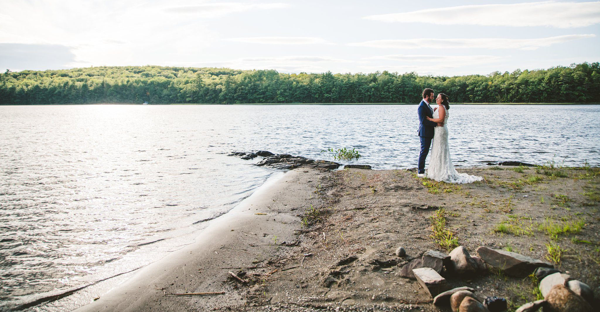 wedding couple on a lake shore.